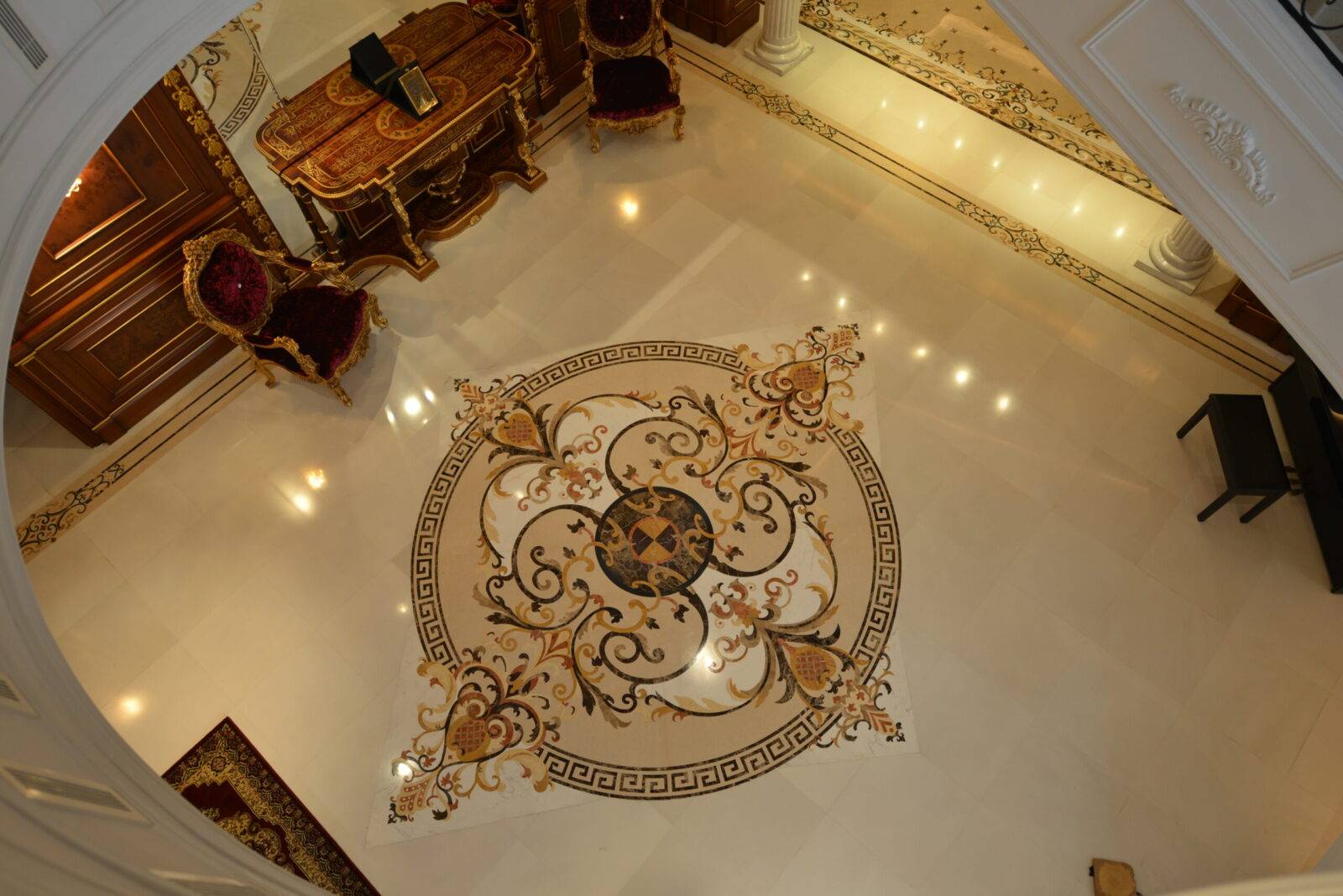 Luxury marble inlay flooring in Bangladesh. Features a custom marble floor medallion and intricate stone inlay design.