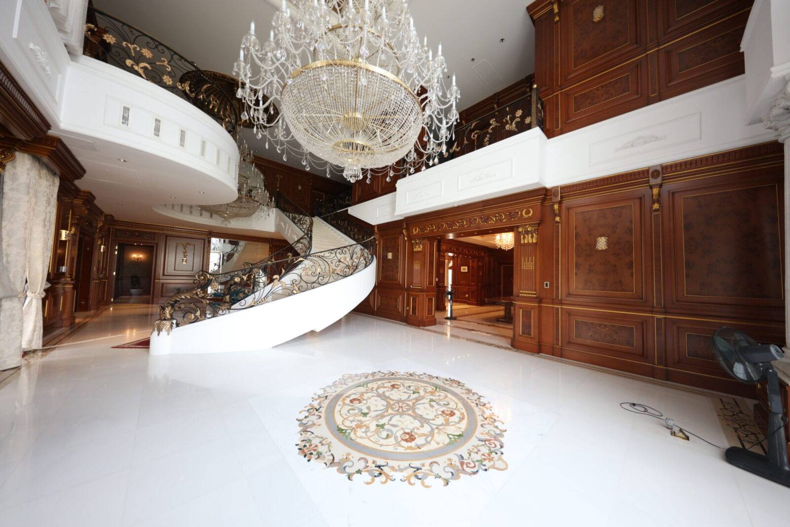 Luxury marble flooring in Bangladesh's Bashundhara Residence features a custom marble inlay medallion and intricate stone craftsmanship.