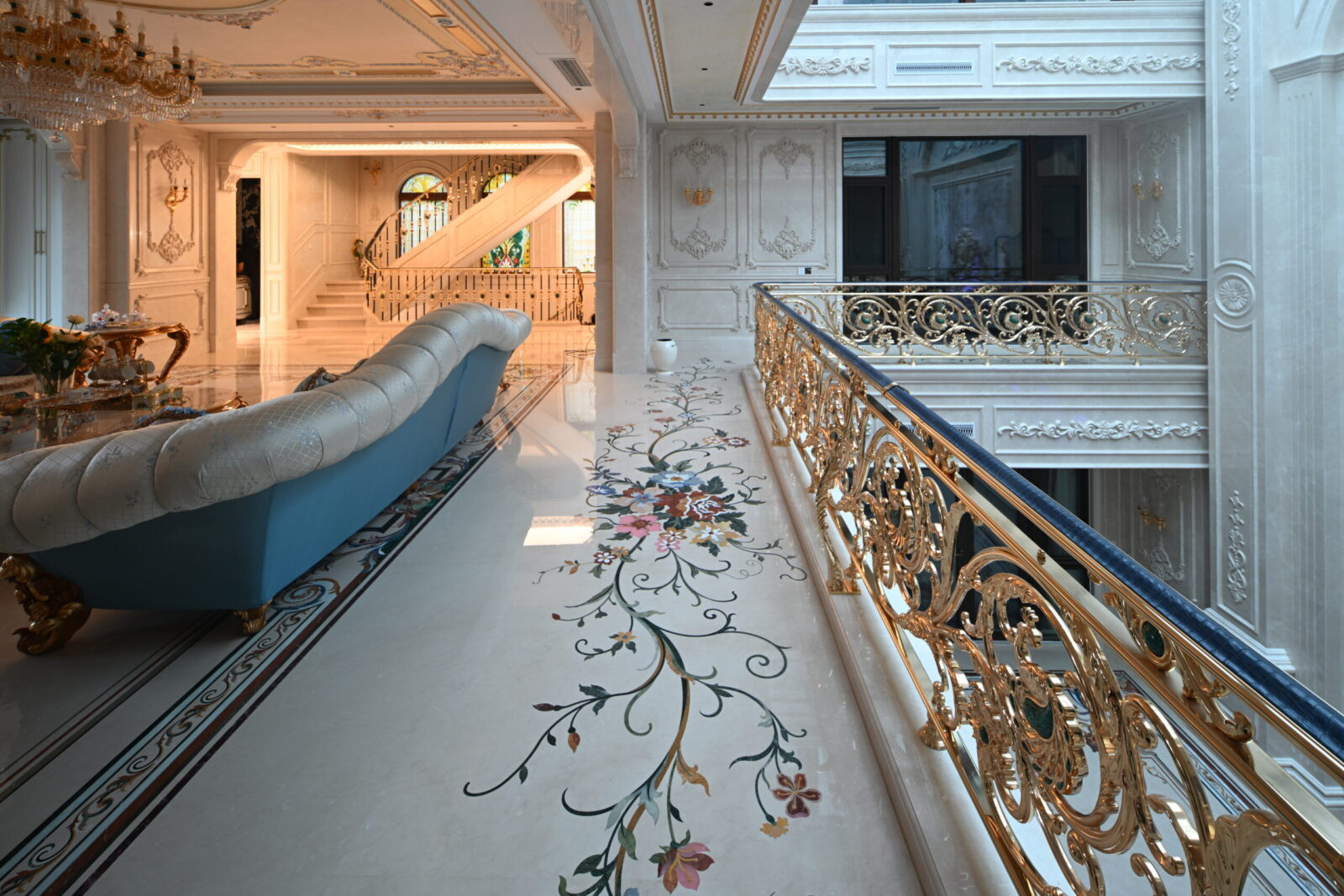 Beijing luxury interiors feature custom marble inlay flooring with floral pattern, a stunning example of pietre dure craftsmanship.