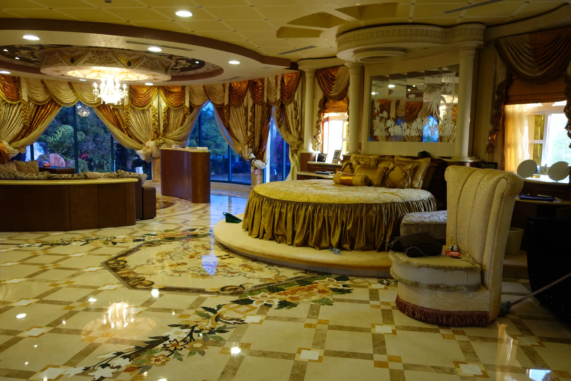 Luxury marble flooring with intricate marble inlay designs and medallions. Custom stone craftsmanship in Tanzania.