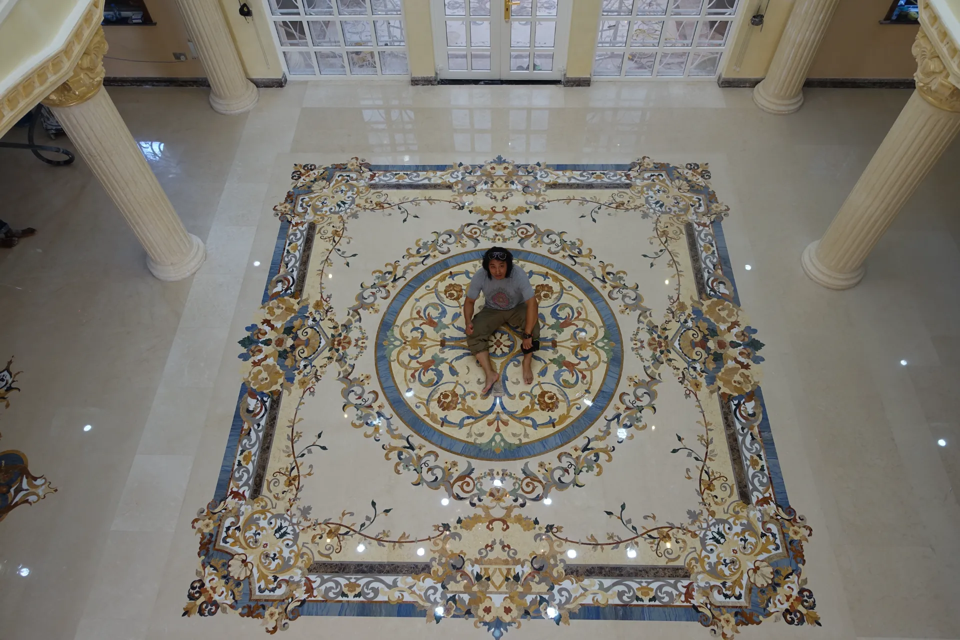 Geometric marble floor medallion in a modern luxury setting