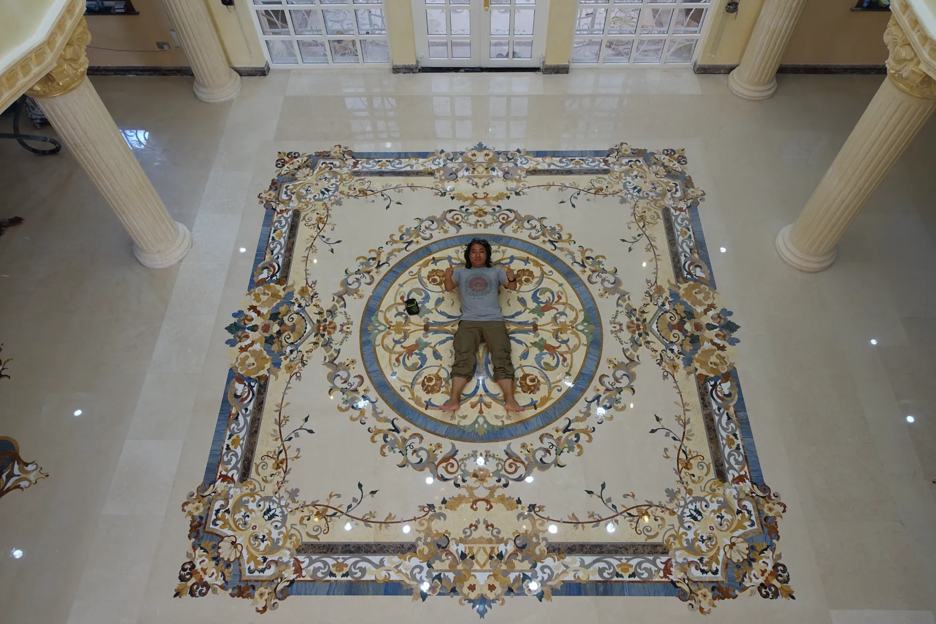 Advanced waterjet machine cutting precise marble floor medallions for a bespoke project.