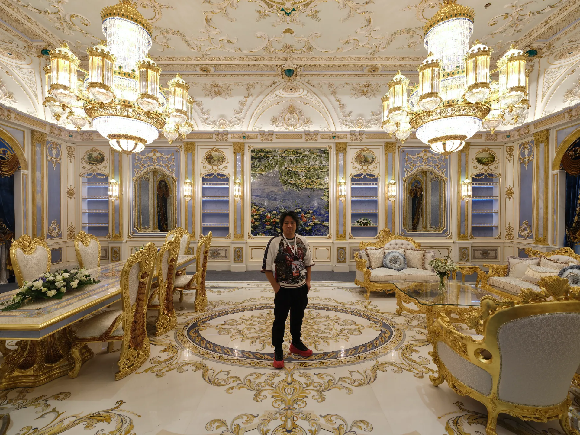 Luxury marble inlay flooring in Guangzhou. Intricate stone inlay design on white marble. Custom marble floor medallion.