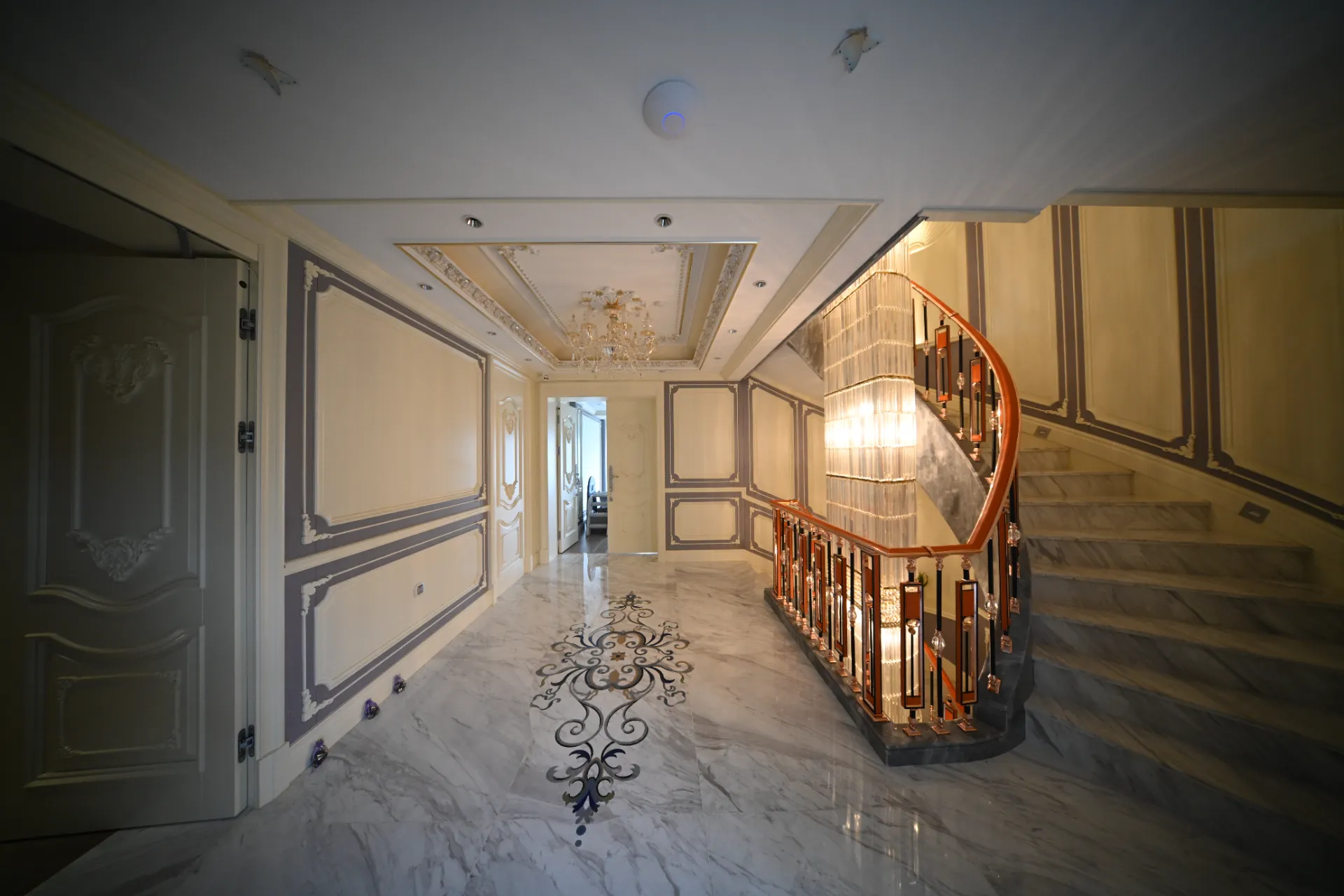 Marble Inlay Floor Medallion in Luxury Hallway