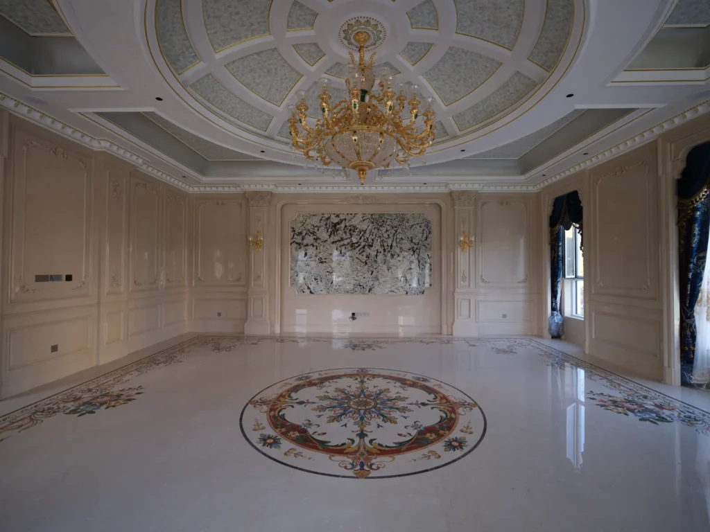 Polished marble floor with a large waterjet medallion and border inlay in a luxury interior.