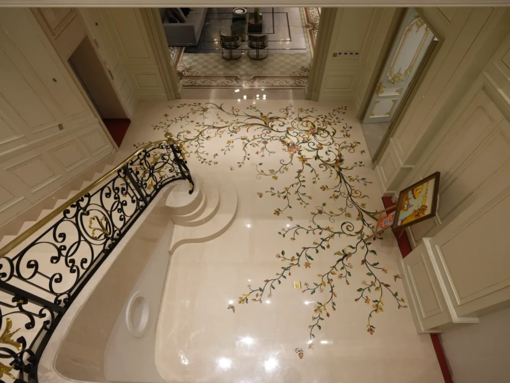 Ballroom medallion, mirrored on the stair hall landing below.