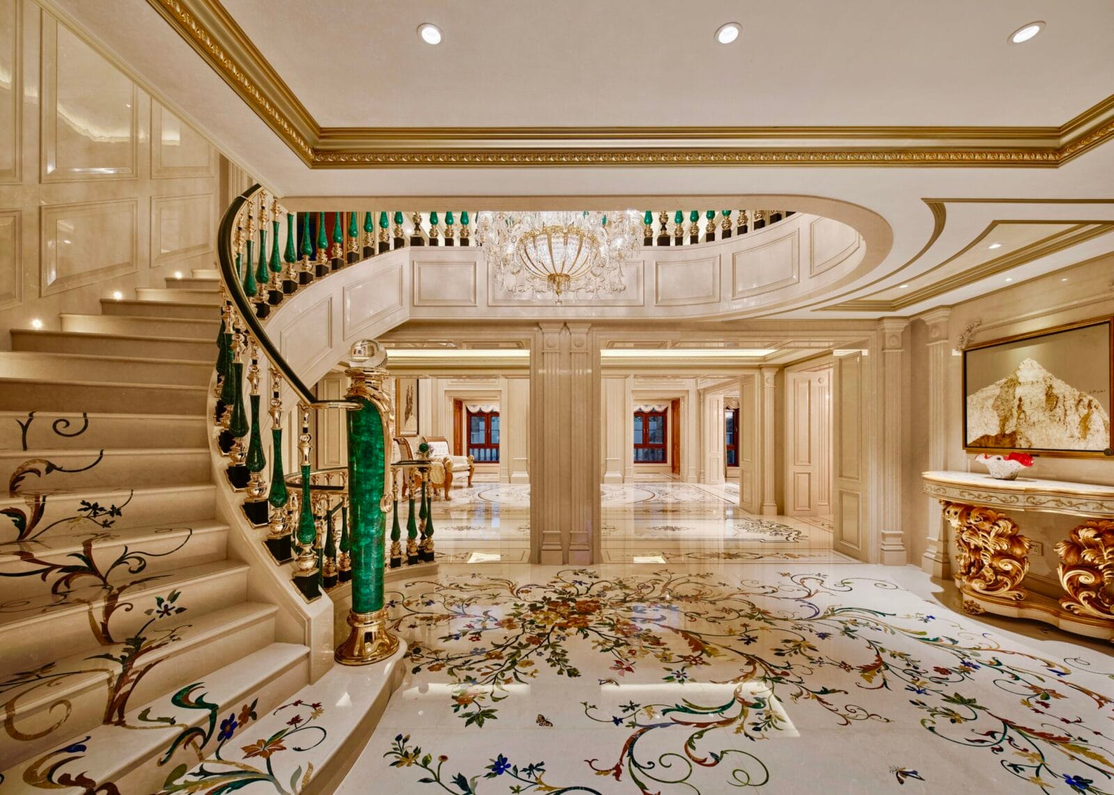 Seamless zero-grout luxury marble staircase and floor installed in an entry.