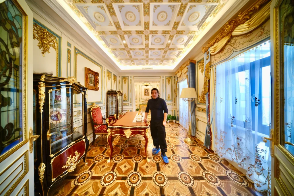 Ornate marble floor inlay with circular medallions and geometric borders in a luxury interior.