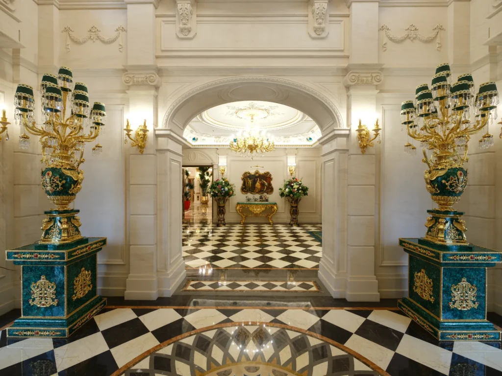 Black and white marble floor with geometric inlay and circular medallion in a classical interior.