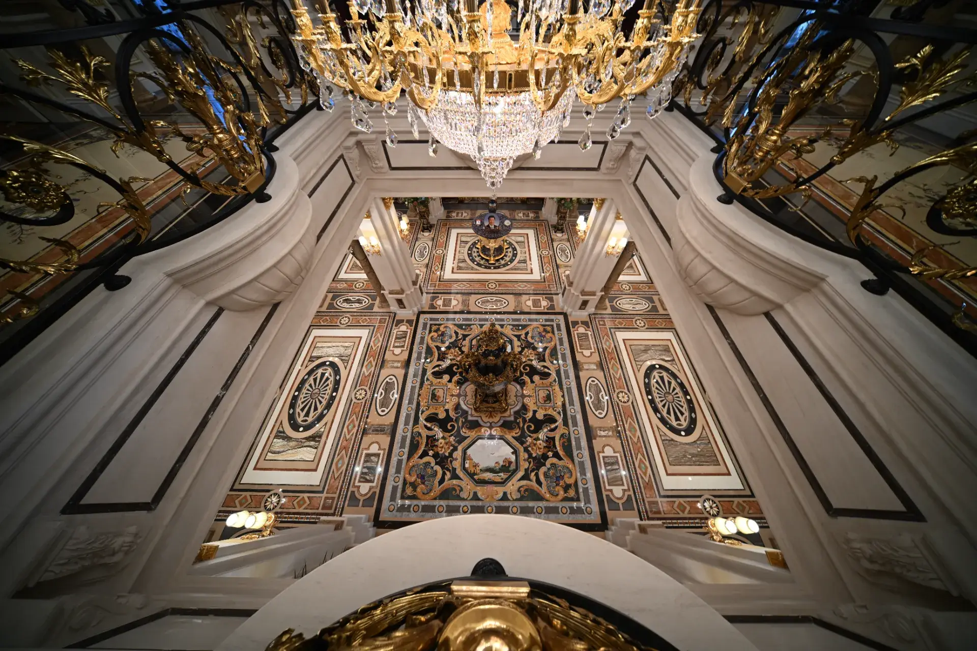 Luxury marble flooring in Mongolia featuring custom marble inlay. Ornate stone inlay design with pietre dure craftsmanship.