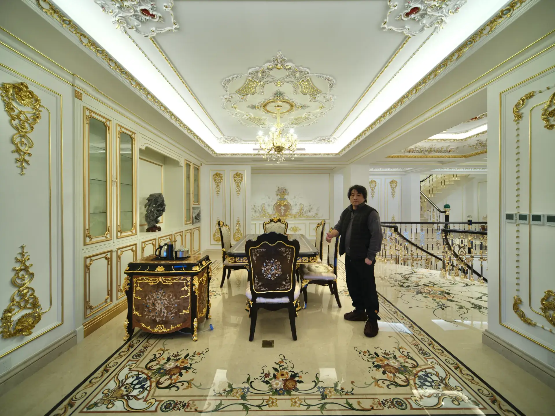 Chongqing luxury interior featuring custom marble inlay flooring. The stone inlay design creates a stunning floor medallion.