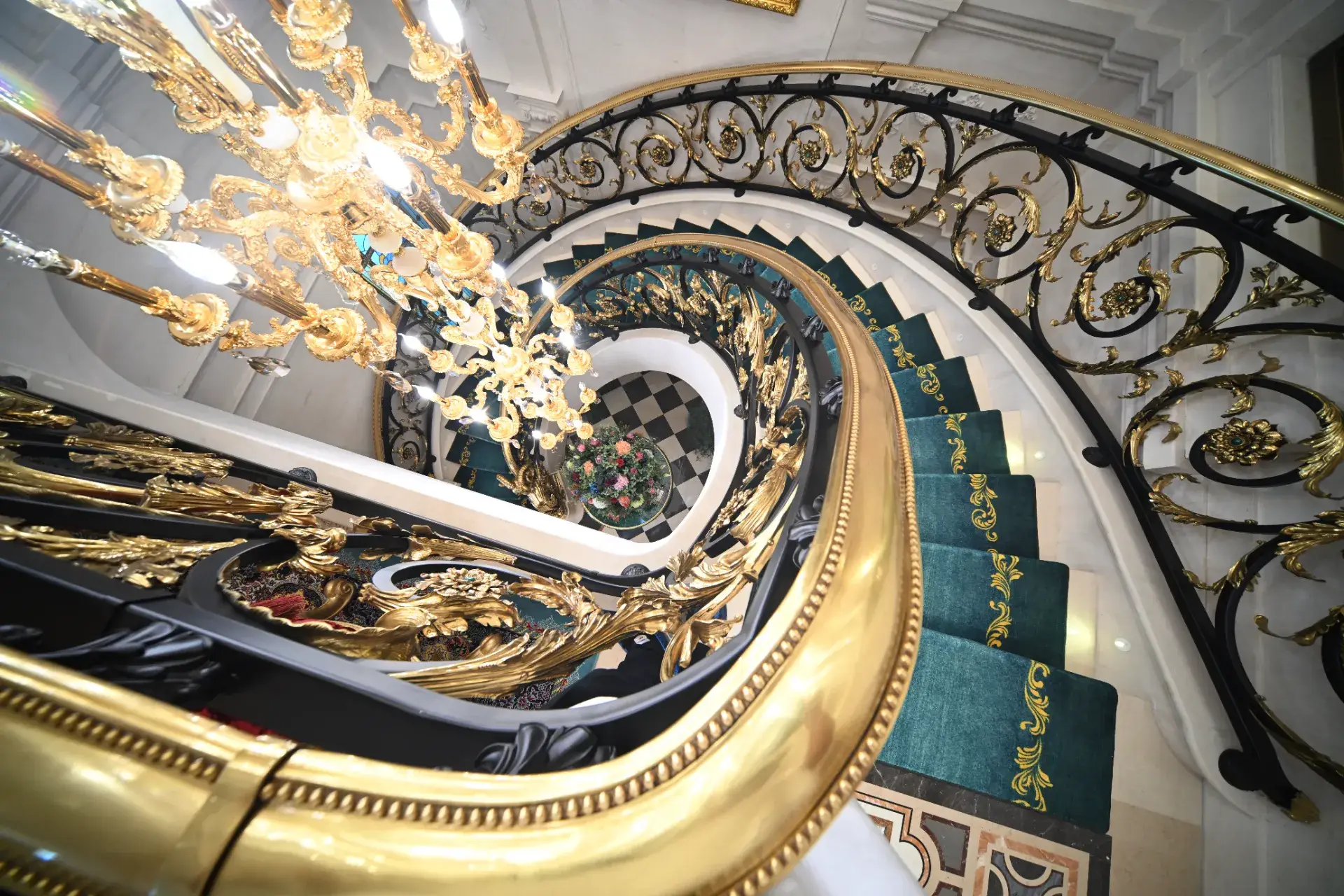 Luxury marble flooring with custom marble inlay and gold accents. Elegant stone inlay design, view from above.