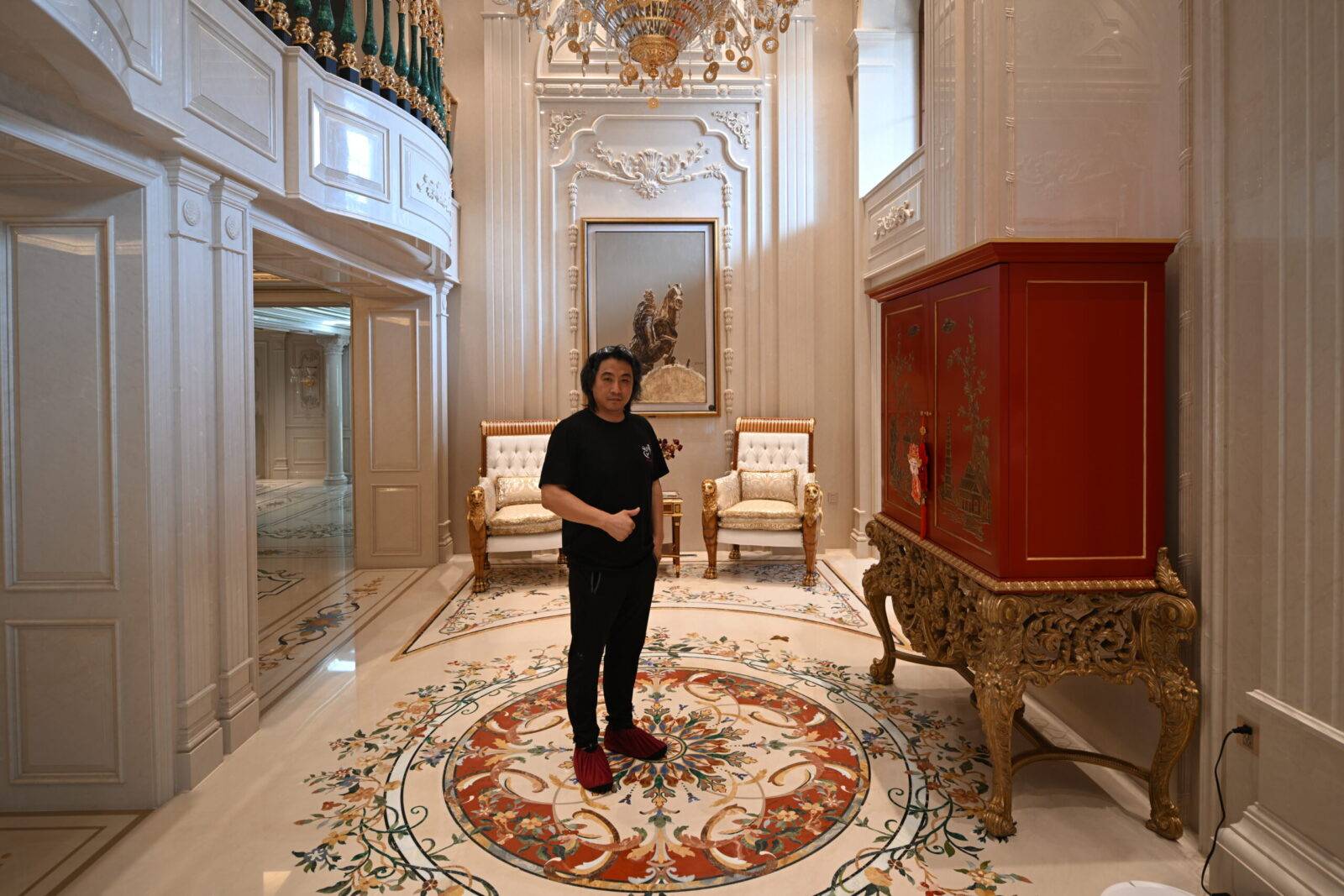 Jiangsu luxury marble flooring with intricate marble inlay. Custom stone inlay design forms a detailed floor medallion.